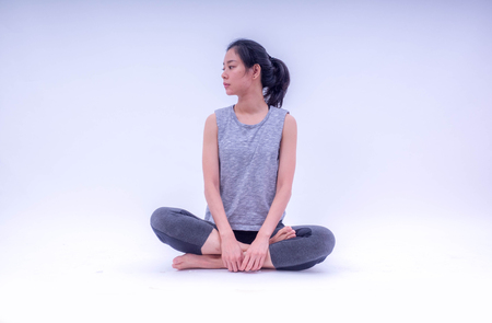 Beautiful young Asian doing meditation at Studio.の写真素材