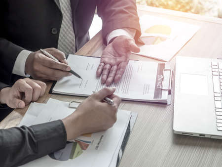 Business Contract Signing client to contract paper at desk