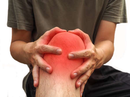 People with knee pain and feeling bad hand on he knee, healthy concept.