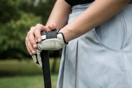 Asian woman golfer doing meditation pose before the game.の写真素材