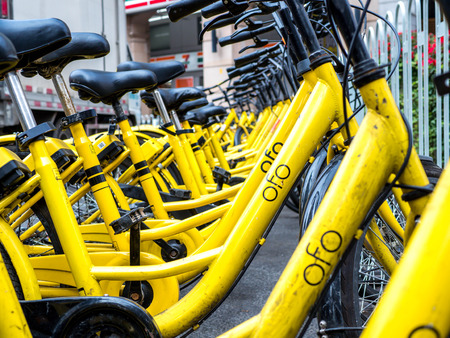 BEIJING, CHINA - MARCH 27, 2018: Ofo Bikes is the new bike sharing company in China. Ofo is a popular bike sharing platform where users grab bikes through an app in many cities in China.のeditorial素材