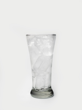 glass with ice cubes on white backgroundの写真素材