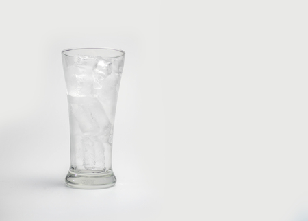 glass with ice cubes on white backgroundの写真素材