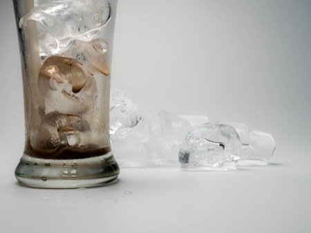 ice cubes in glass on white background