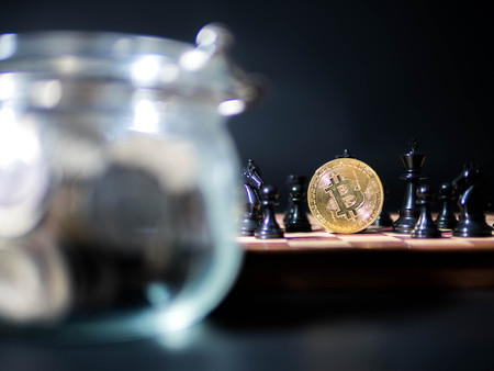 Bitcon, Coins in Glass Jar with Golden coin  isolated on black background.
