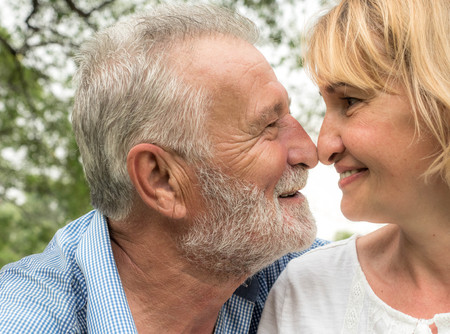 Nice elderly couple together in a summer park, Happy senior couple walking in park, Happy lifeの写真素材