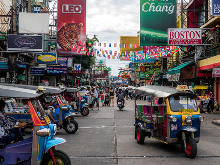 Bangkok, Thailand - August 19, 2018: Khao San Road, famous tourist destination and popular tourist in Bangkok, with cheap accomodations and a lot of bars, crowded at night with people partying.のeditorial素材