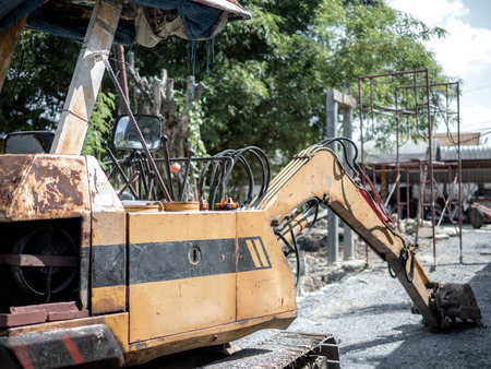 construction site with digger loading trucks