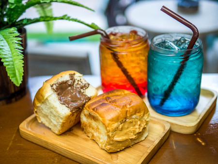 Italian soda and bread stuffed with chocolate. sweet with soda on the table.