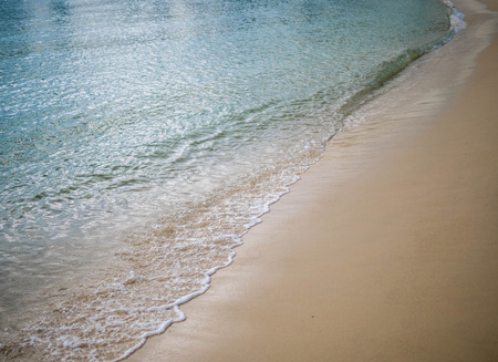 Sand beach with wave of the sea.の写真素材