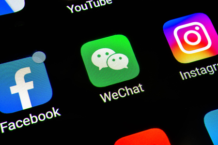 Bangkok, Thailand - June 15 2019: Macro photo of Wechat application icon on a smartphone screen. Wechat messenger app icon. Social media network.のeditorial素材