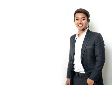 Portrait of a asian man with headset working as a call center operator.