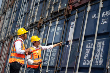 Engineer staff team checking and inspect container for international business logistic import and...