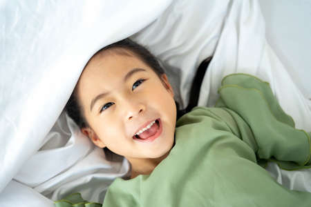 Asian smiling little girl portraitの写真素材