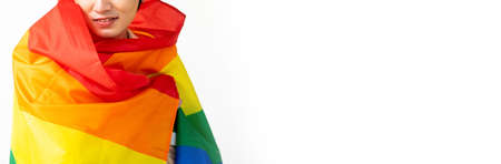 Smiling transgender with pride flag isolated on white background with copy space. People lifestyle...