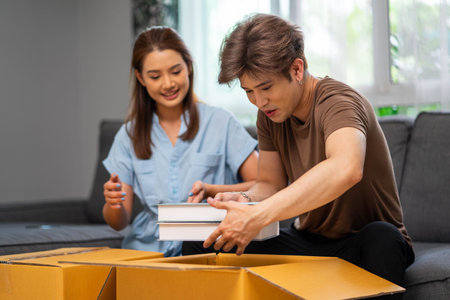 Young couple moving into their new homeの写真素材