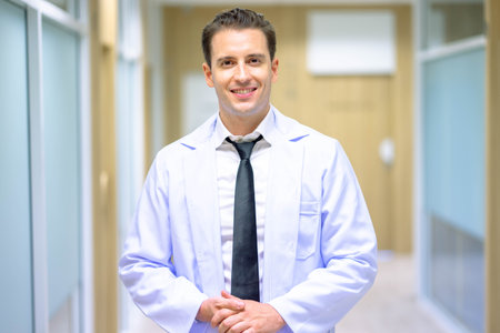 happy Young pharmacist face smiling and looking at the camera. Positive person.の写真素材