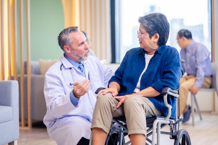 Doctor consulting senior old patient. doctor talking to a patient in the officeの写真素材
