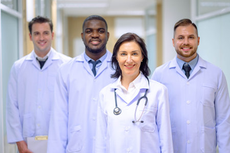 Professional doctor working in hospital office or clinic with other doctors. Healthcare people group.の写真素材