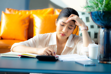 Woman having financial problems with invoices and Credit Cards, Money concept,  Bankrupt Female having problem income.の写真素材