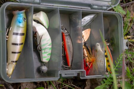 fishing accessories in a plastic box. set of Spinners and lures.の写真素材
