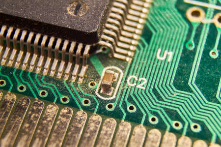 dusty printed circuit Board with components. macro. selective focus
