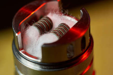 Vape RDA or e-cigarette for vaping with coils and cotton, rebuildable dripping atomizer or vaporizerの写真素材