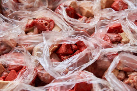 preparation of food for raw feeding. BARF food for dogs and cats. Packaging of food for animalsの写真素材