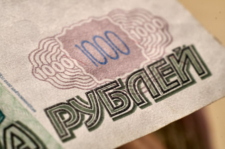 Banknotes and coins of the Russian ruble. Details of Russian money in close-up. The inscription rubles on a paper bill.の写真素材