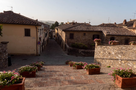 A quiet street of residential buildings in the village of Panzano Tuscanyの写真素材