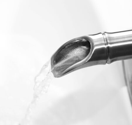 faucet with running water coming outの写真素材