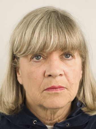 Depressed senior woman facial portrait close upの写真素材