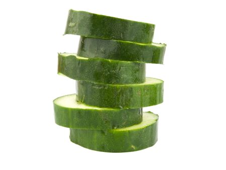 Green Cucumber sliced on a white backgroundの写真素材