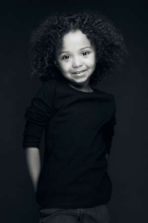 The natural beauty of a little girl under the effect of black and white and also the splendor of her...
