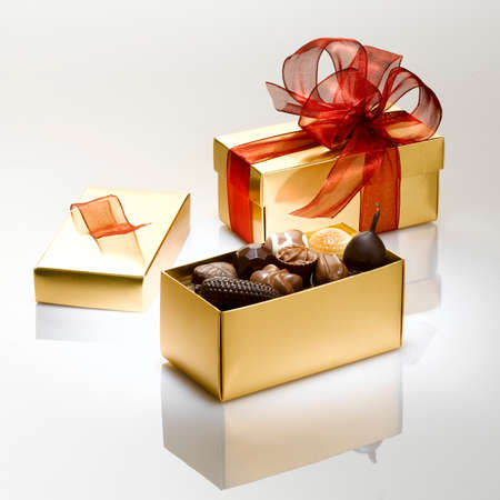 Beautiful gift boxes full of chocolate ready to be offered to mark your love for all kinds of events or special day for your loved ones or your entourages.の写真素材