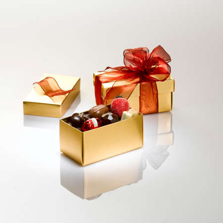 Beautiful gift boxes full of chocolate ready to be offered to mark your love for all kinds of events or special day for your loved ones or your entourages.の写真素材
