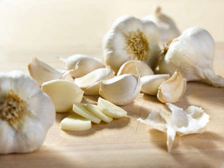 Cloves of white garlic that we just took from a garden to give taste to the food and to have a good smell.の写真素材