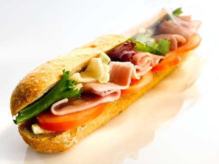 A large, well-stocked sandwich with all the necessary ingredients for a good sandwich that everyone will want to eat.の写真素材