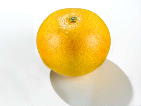A fresh grapefruit with its natural yellow color which already shows that the fruit is very sweet.の写真素材