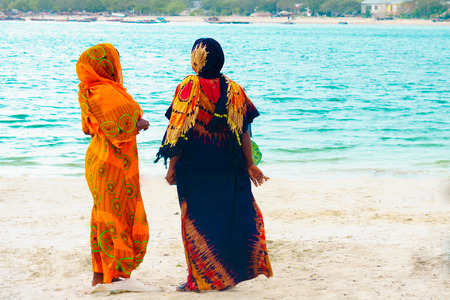 Women standing in Zanzibar beachの写真素材