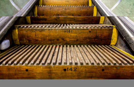 Old, wooden, numbered Escalator stepsの写真素材