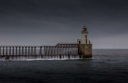 Morning at Blyth beach, with the old wooden Pier stretching out to the North Seaの写真素材