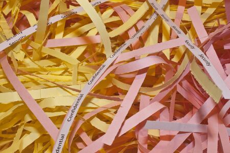 confidential papers that have been shredded to avoid identity theftの写真素材