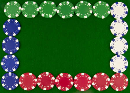 border of poker chips on green beizeの写真素材