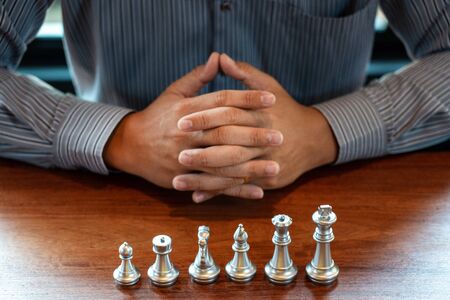 Business man moving chess game for business competition and team work concept.の写真素材