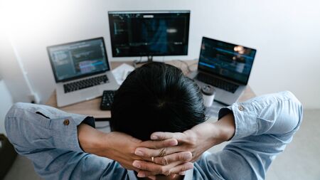 Programmer Typing Code on desktop computer, Developing programming and coding technologies conceptの写真素材