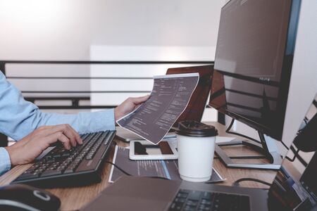 Programmer Typing Code on desktop computer, Developing programming and coding technologies concept