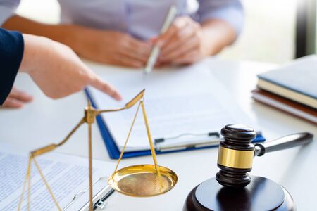 Female Lawyer explaining legal situation and discussing with contract papers, Concepts of law,...