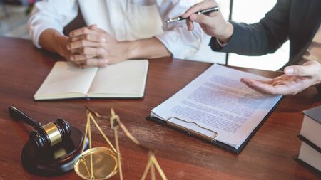 Male Notary lawyer or judge consult or discussing contract papers with Businessman client in office,...