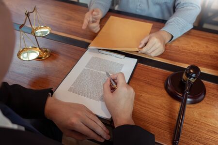 Male Notary lawyer or judge consult or discussing contract papers with Businessman client in office, Law and Legal services conceptの写真素材